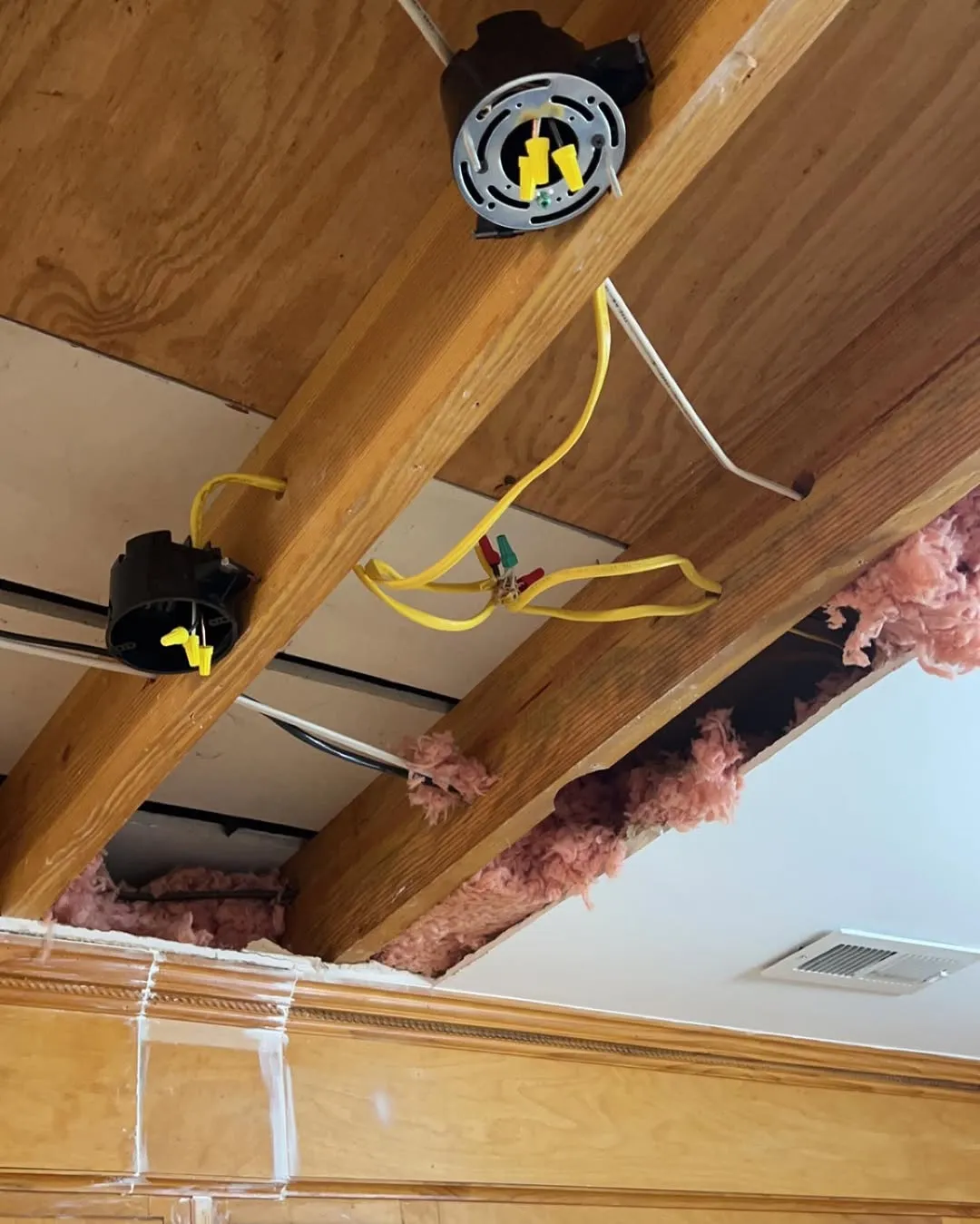 New electrical wiring run through ceiling joists for pendant lights and recessed lighting