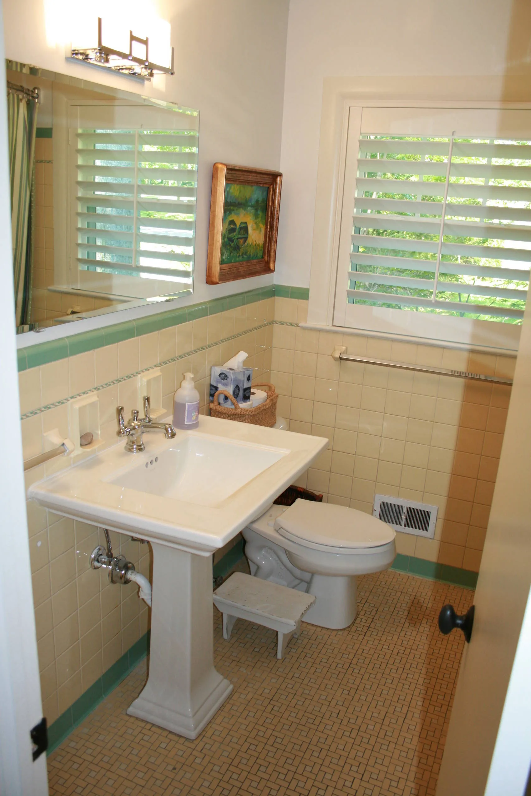 Outdated bathroom with old fixtures and vanity ready for a remodel
