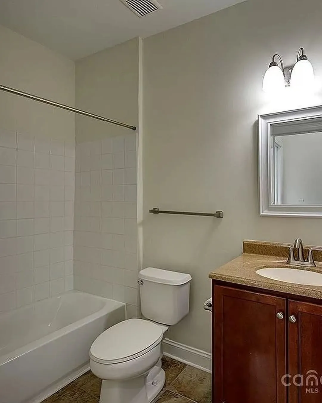 Completed bathroom remodel with modern finishes by Allforce Services